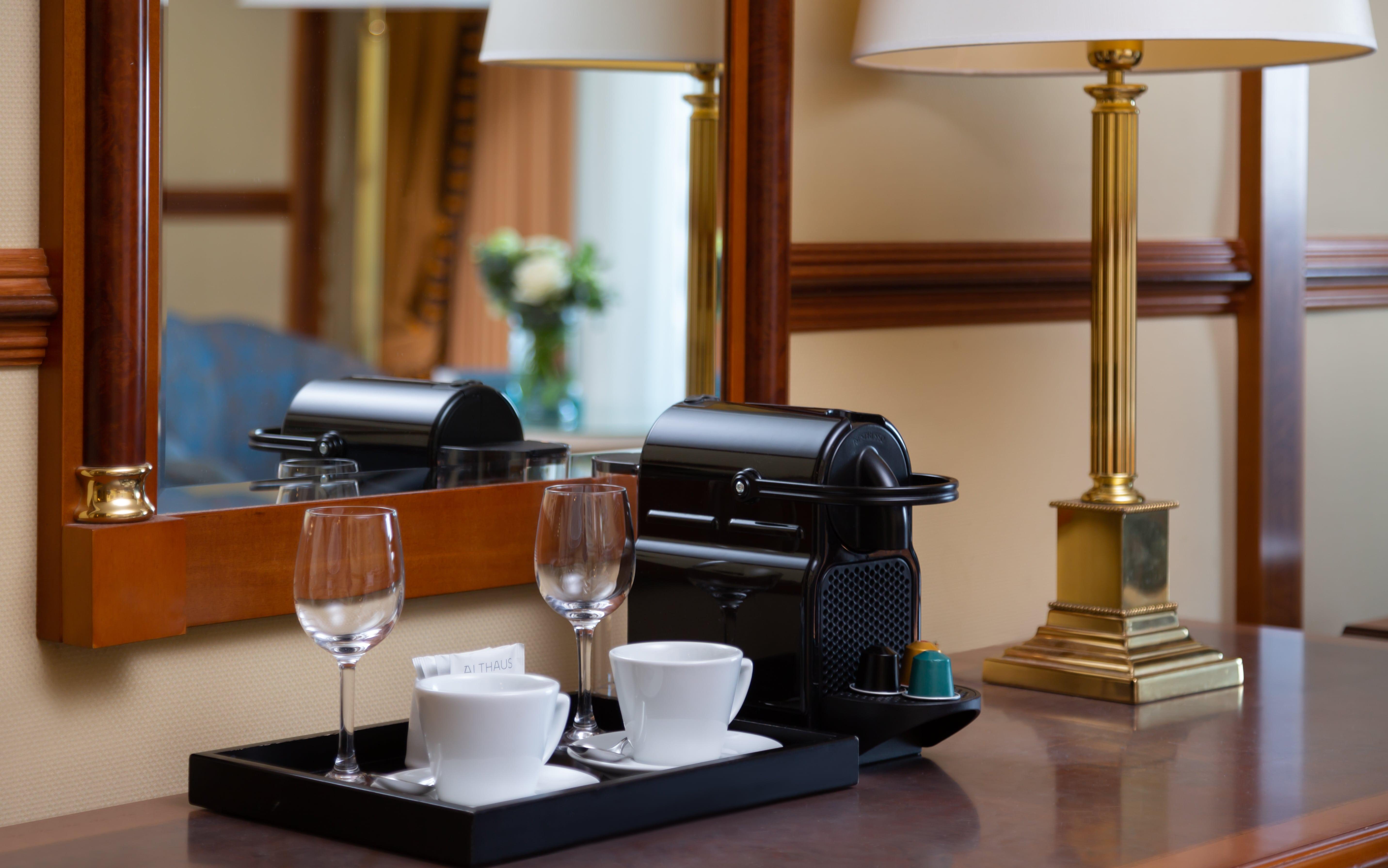 Grand Hotel 부쿠레슈티 외부 사진 A Nespresso coffee machine in a hotel room